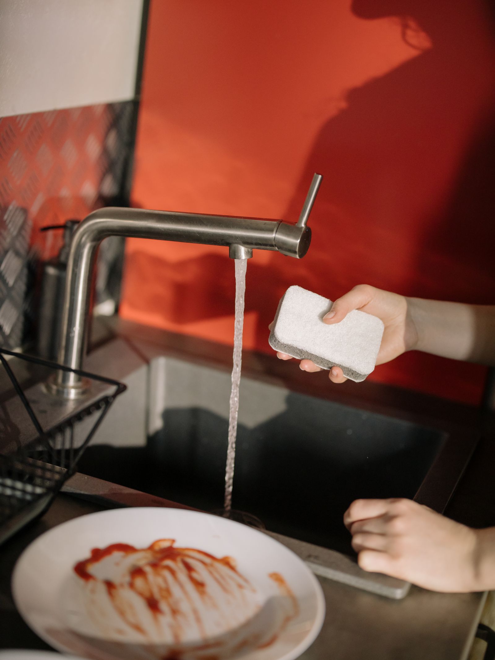 Pretreating greasy dishes with dish soap powerwash spray