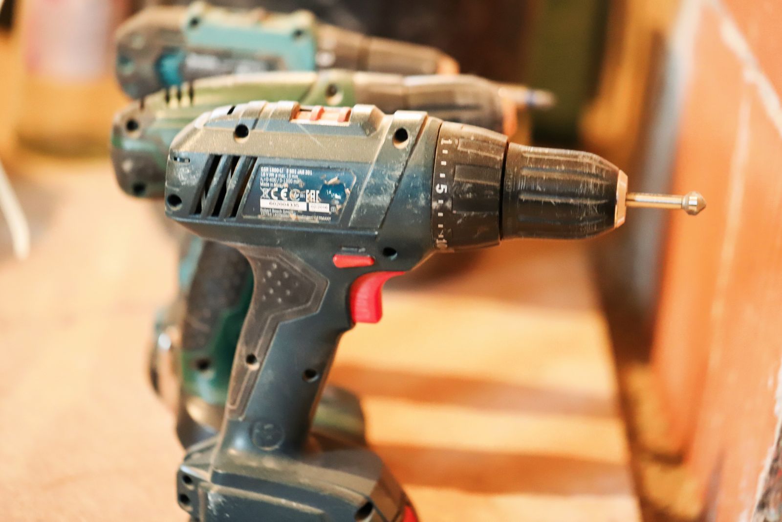 Drill-mounted scrub brush attachments